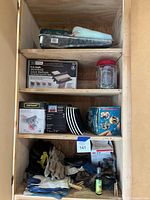 Full view of cabinet interior with shelves and contents