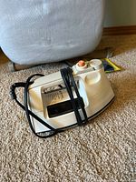 Black & Decker beige steam iron with cord