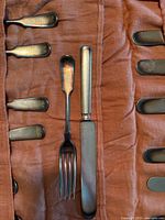 Close-up of one fork and knife in roll showing style and finish