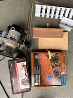 Overall view with router, Craftsman template box, Rockler template box, plastic guide and wooden blocks