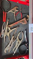 Drawer showing all tools including pipe wrench, locking pliers, band wrench, needle-nose pliers