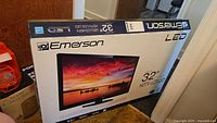 Sealed Emerson LF320EM5F HDTV retail box front