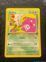 Front of Koffing 1st Edition Team Rocket card showing illustration, stats, attacks, stamp and card number