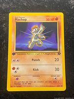 Front of Machop 1st Edition Team Rocket card showing artwork, attacks, 50 HP, 59/82