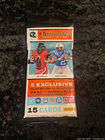 Front of sealed 2022 Panini Chronicles Draft Picks fat pack showing artwork, card count and exclusive insert information