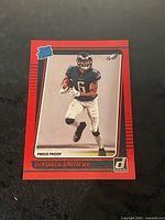 Front of DeVonta Smith Rated Rookie Press Proof Red card