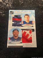 Front of Rookie Sweaters dual patch card showing player images and two fabric swatches