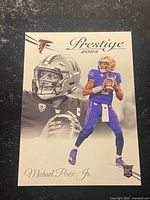 Front of Michael Penix Jr. rookie card showing photographs, Prestige 2024 logo, RC shield
