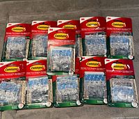 Front view of all 11 Command light clip packs