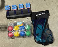 Overview of bocce set, snorkel gear in mesh bag and electronic shooting target