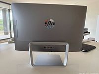 Rear view showing HP logo, stand and ports