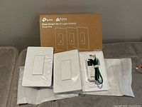 Outer retail box and three packaged switches displayed