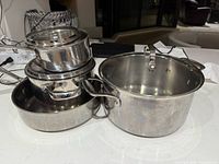 Stack showing all pots, pans and some lids