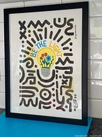 Full view of framed painting showing artwork, frame, scale