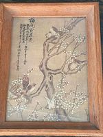 Full view of framed Chinese painting with birds and blossoms