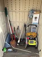 Full view of storage shed interior showing all listed items