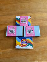 Top view of four boxed Easter egg decorating kits on table