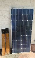 Full view of solar panel and two wooden posts