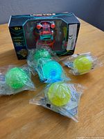 Front view showing boxed Unicycle toy and five sealed balls