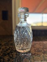 Full view of crystal decanter front showing cut pattern and stopper