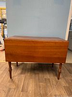 Table with leaves down showing overall form and legs