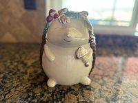 Front view of ceramic hedgehog cookie jar