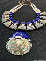 Close view of inlay segments and pendant