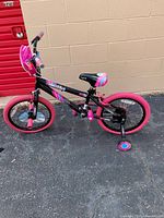Right side view of full bicycle showing frame, tires, and training wheels