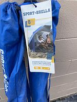 Close-up of hang tag on Sport-Brella bag showing product details