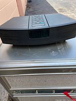 Front view showing speaker grille and display