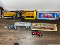 Group shot of all five die-cast vehicles with packaging