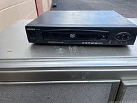 Front view showing Digix branding, disc tray and control buttons