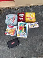 Top-down view of board games on pavement