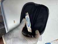 Knife in zippered case showing enamel handle artwork