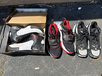 Three pairs of sneakers; Jumpman Pro in box, two additional pairs alongside