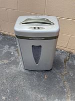 Front three-quarter view of Staples shredder showing full unit