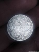 Reverse showing 25 Cents Canada 1907 with maple-leaf wreath and crown