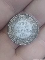Reverse side showing ONE CENT CANADA 1911 and maple leaf wreath