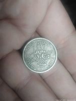 Reverse with crowned lion, date 1949, denomination ONE SHILLING