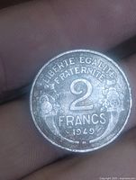 Reverse of 2 francs coin showing denomination, motto, date 1949