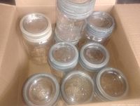 Box containing nine glass mason jars with lids