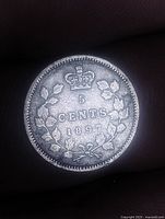 Reverse of coin showing crown, wreath, denomination and date