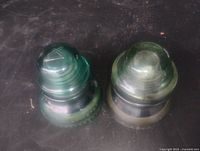 Top view of both glass insulators showing colors and tops