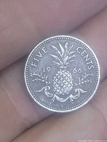 Reverse of 1966 Bahamas 5¢ coin showing pineapple design, denomination, and date