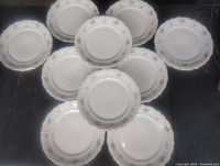 Plates front view arranged showing floral rim pattern