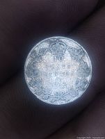 Reverse of 1914 Canadian 10 cents coin showing denomination, wreath and crown