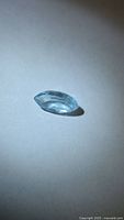 Side angled view of marquise aquamarine showing faceting and clarity