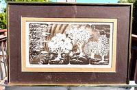 Full view of framed etching showing four tree panels