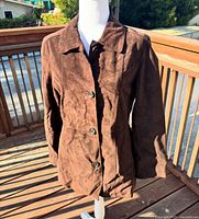 Front view of brown suede coat on mannequin