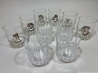 Group shot of all ten tumblers showing numbered and faceted styles